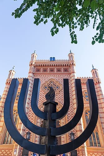 Romania-Bucharest-Choral Temple Synagogue Menorah sculpture in front Art Print